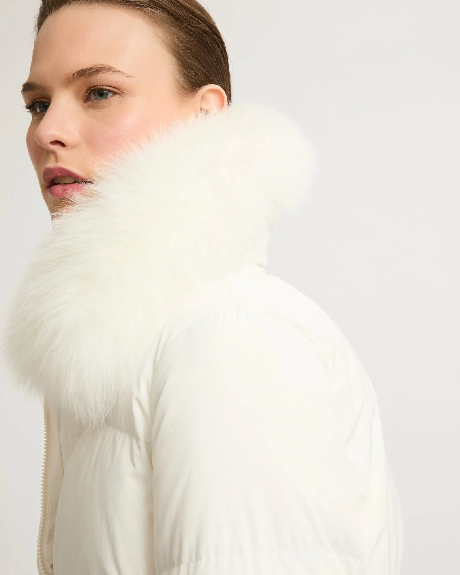 Long belted down jacket in technical fabric with fur collar