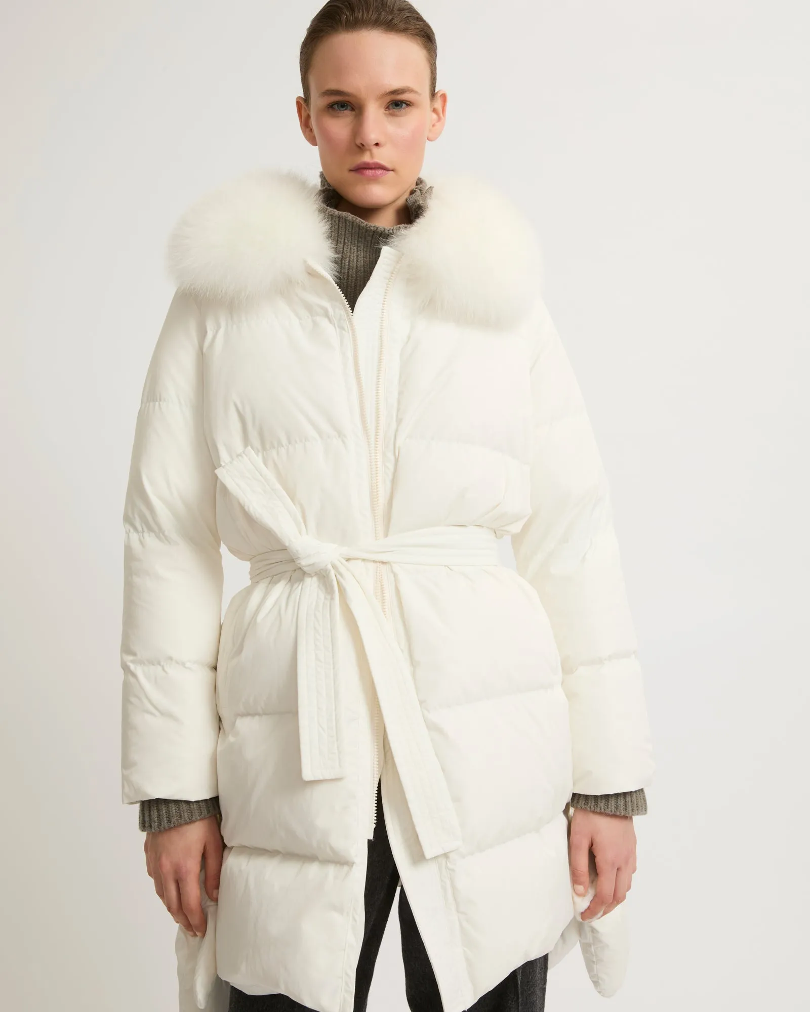 Long belted down jacket in technical fabric with fur collar