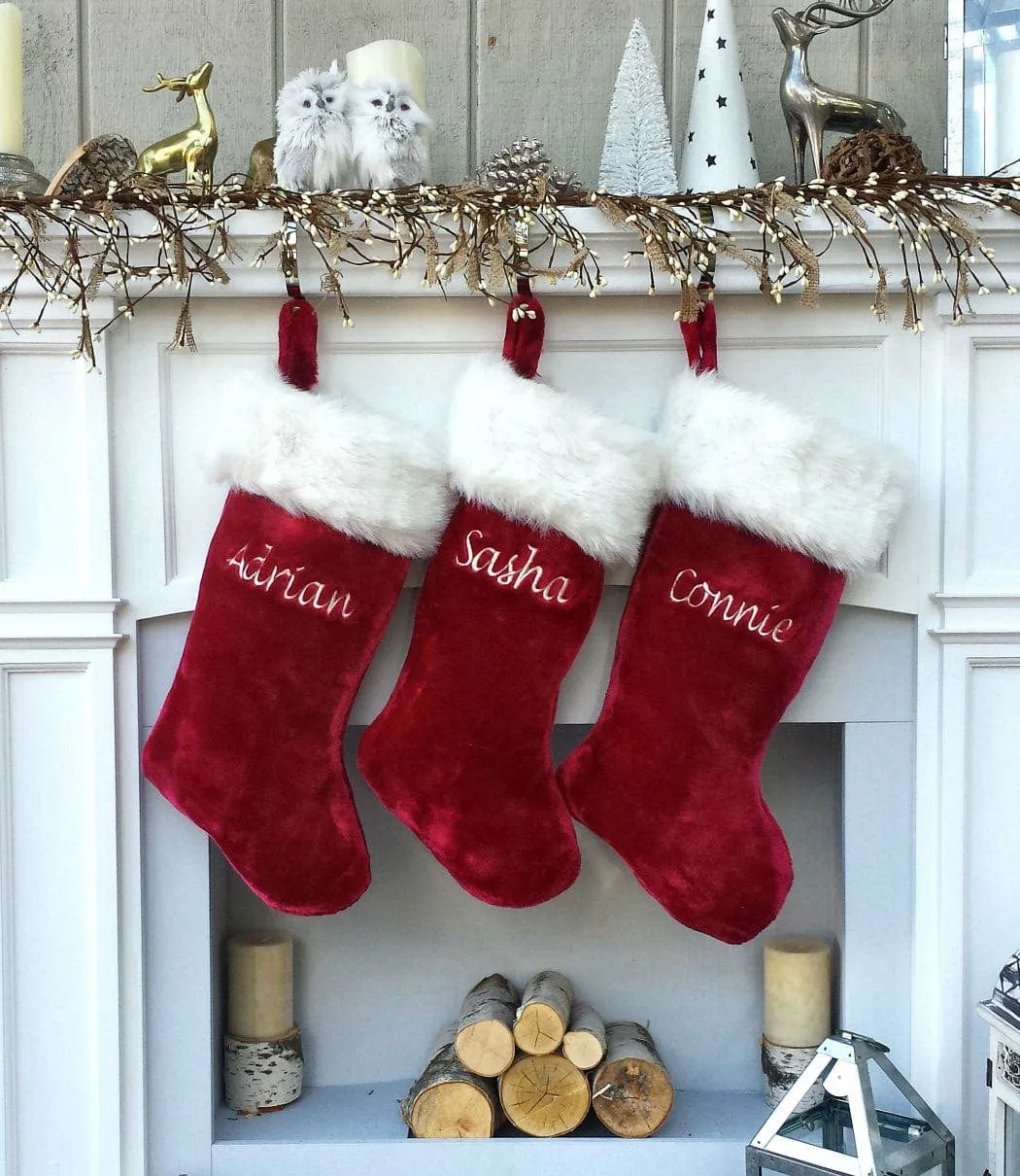 This luxurious plush 21'' Christmas stocking is a deep burgundy color with faux fox fur trim.